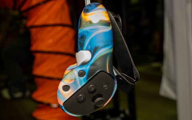 Custom-skinned Meta Quest 3 controller at a Pixel Forge Arcade station